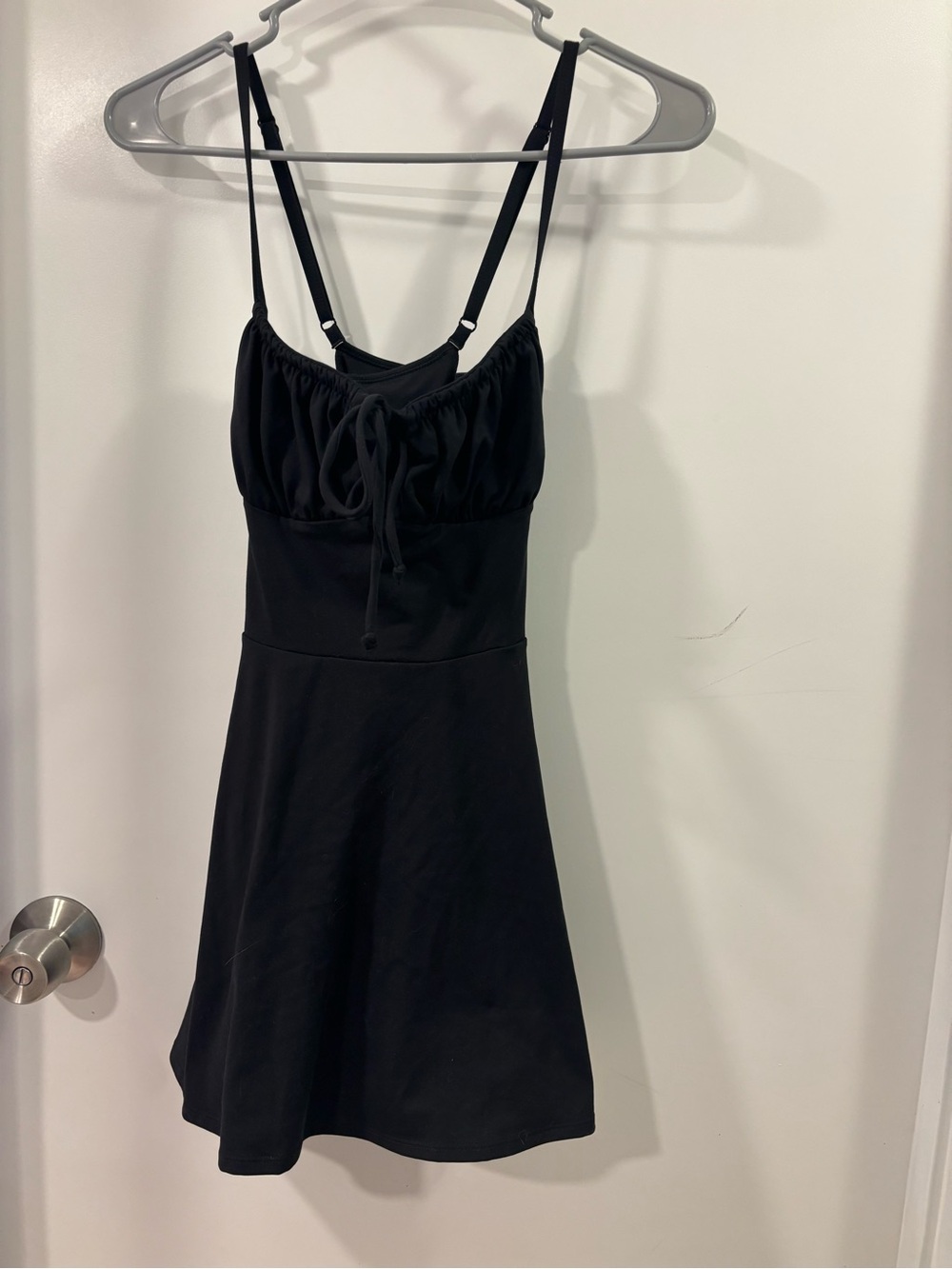 Black Spaghetti-Strap Athletic Dress with Front Tie and Built-in Shorts